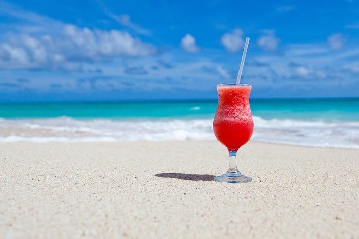 A drink on a beach, illustrating the importance of the sense of taste in the dental environment