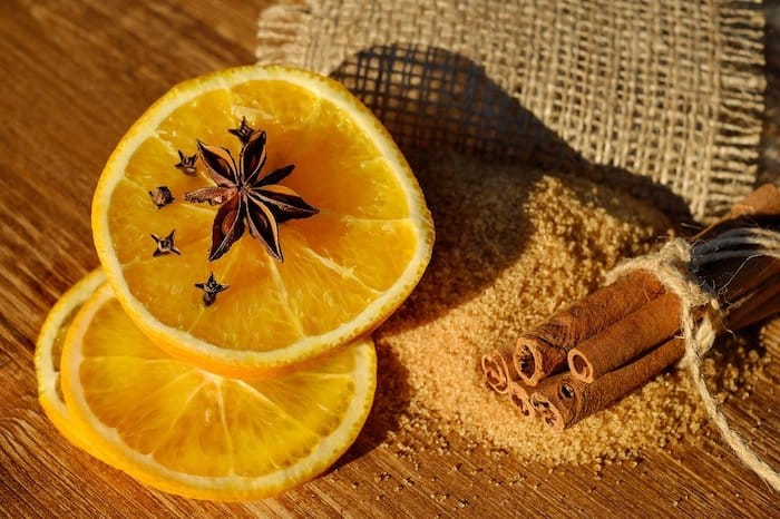 Photo of an orange with cloves, illustrating the importance of the sense of smell in the dental environment