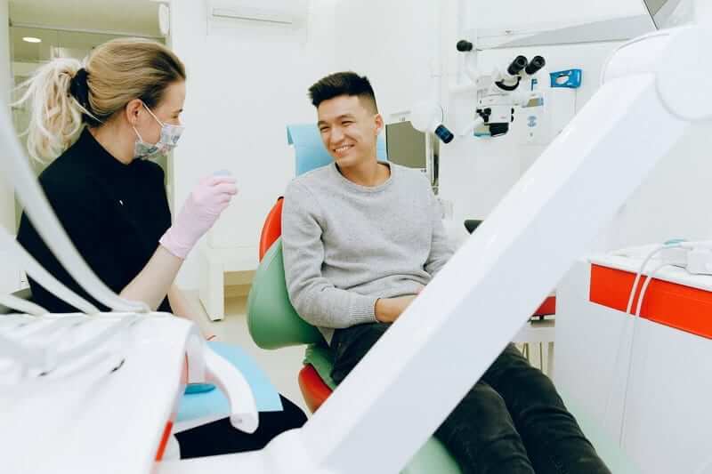 Dentist with a happy patient