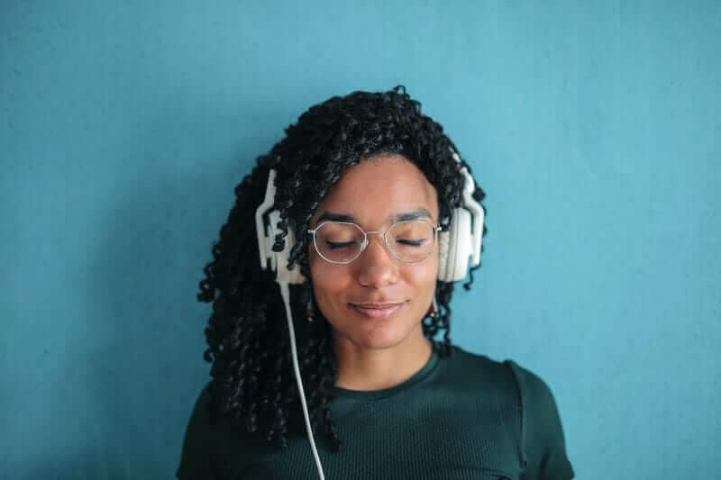 Using headphones can help with drowning out noises during dental treatment