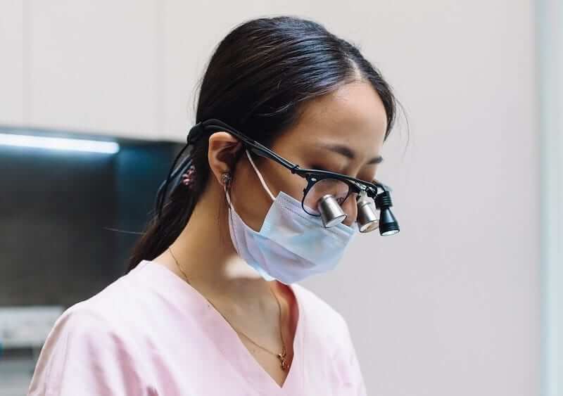 Loupes should be used for fine dental work such as root canal treatment. They look like little binoculars.