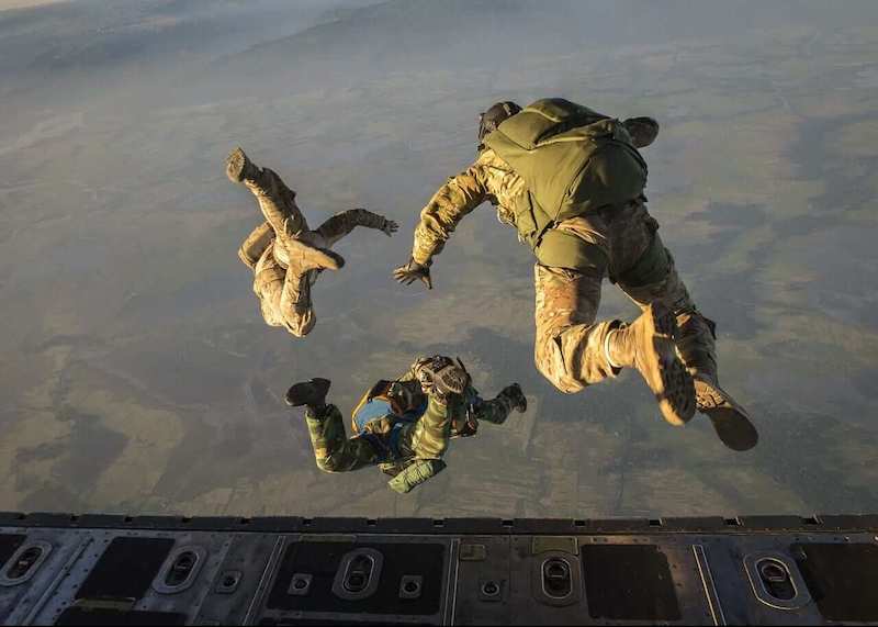 Paratroopers jumping out of plane