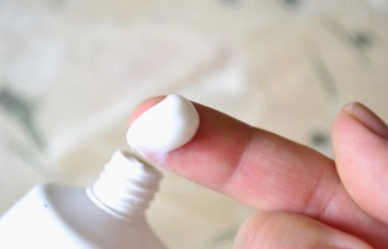 Put the toothpaste on your finger and rub it into the sensitive areas