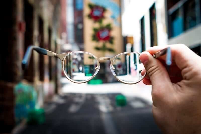 Person taking their glasses off