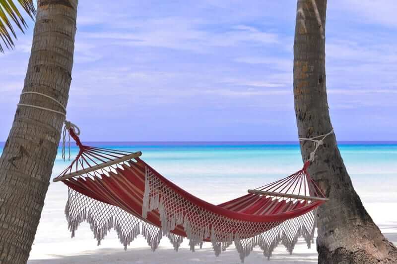 A hammock on a beach, symbolising relaxation